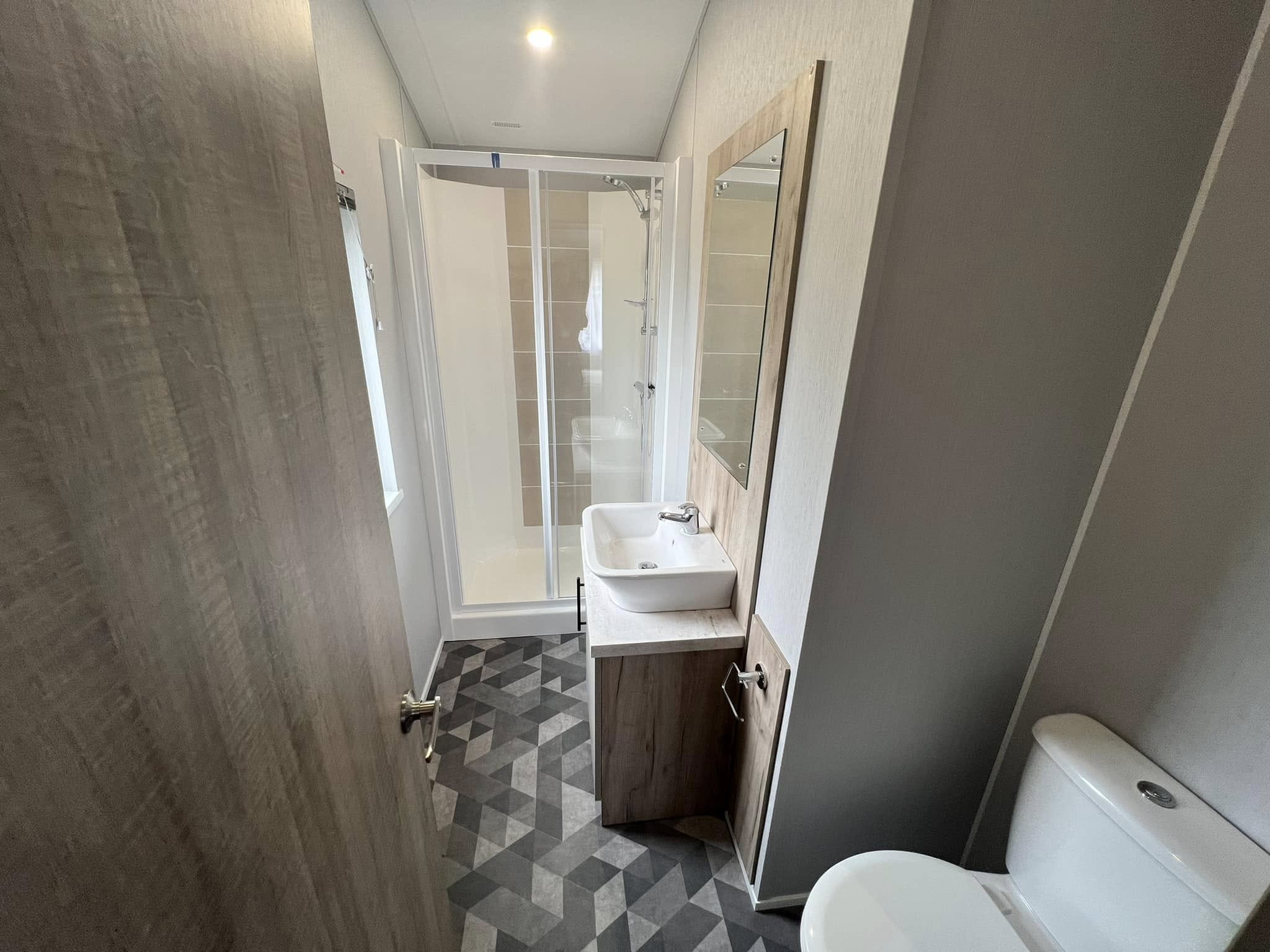 Bathroom of Mapleton Lodge, including toilet, sink and shower