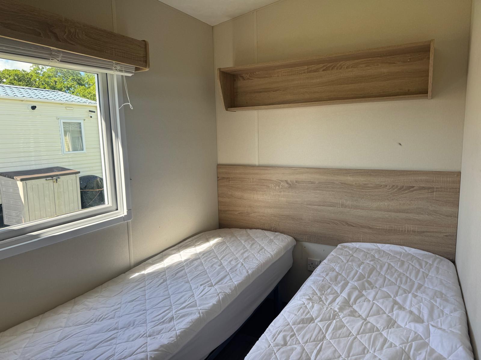 Twin bedroom with 2 beds in Delta Santana 2019 caravan at Windy Harbour Holiday Park
