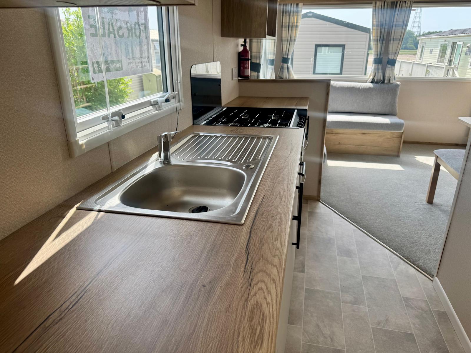 Kitchen area in the ABI Coworth 2024 caravan at Wardleys Creek Holiday Park