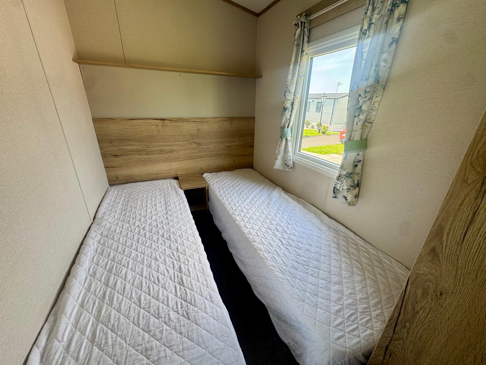 Twin bedroom in the ABI Coworth 2024 caravan at Wardleys Creek Holiday Park