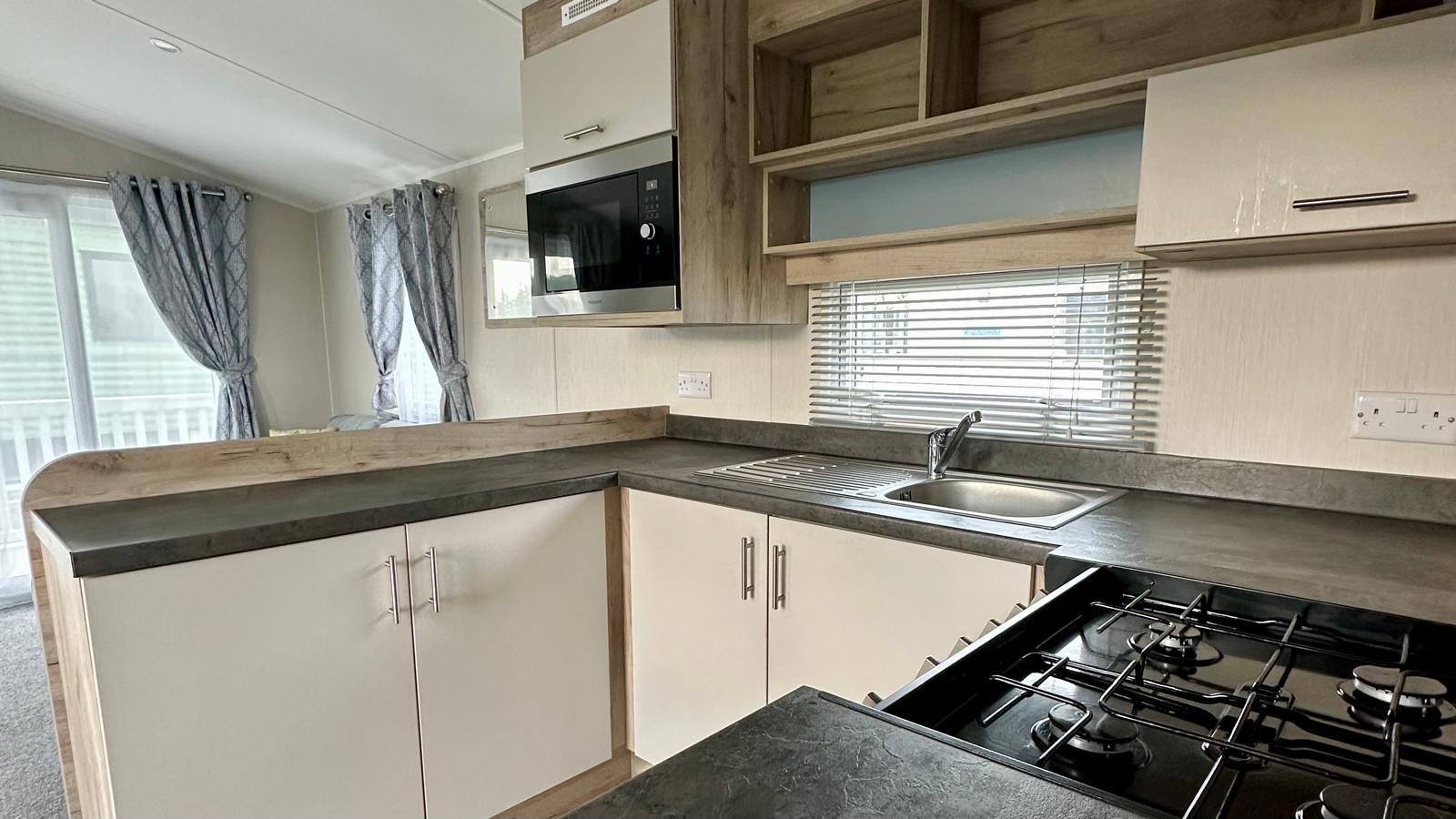 Kitchen area in the Willerby Linwood 2022 caravan at Windy Harbour Holiday Park