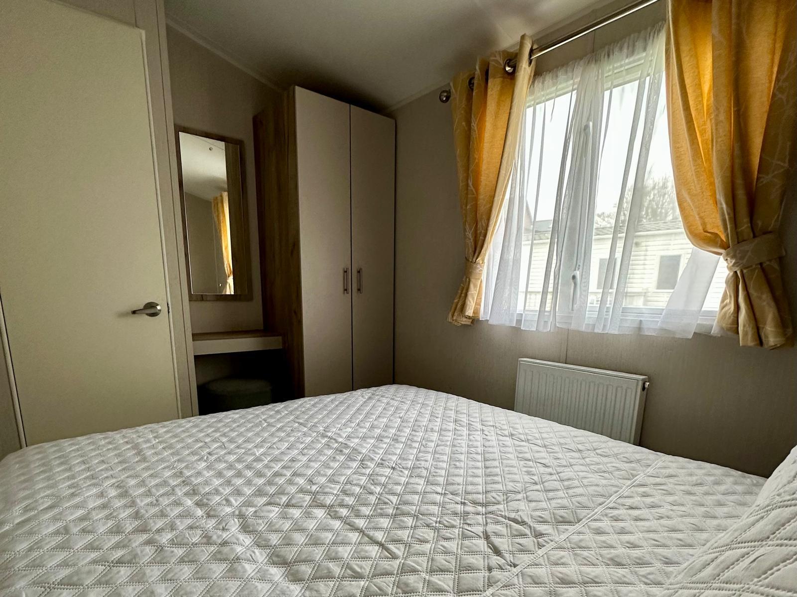 Master bedroom with double bed in the Willerby Linwood 2022 caravan at Windy Harbour Holiday Park
