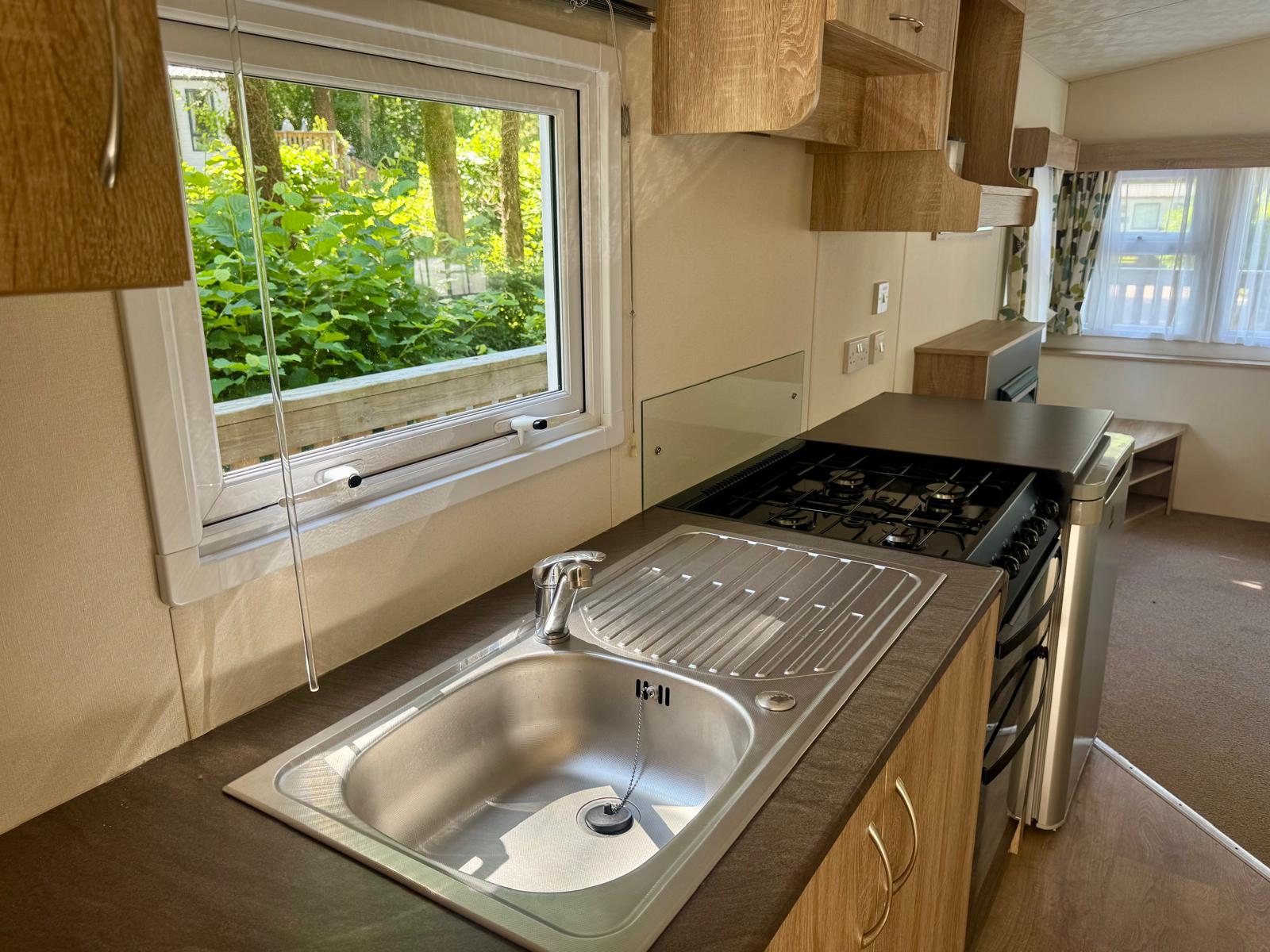 Galley kitchen in the Delta Santana 2019 caravan at Black Beck Holiday Park