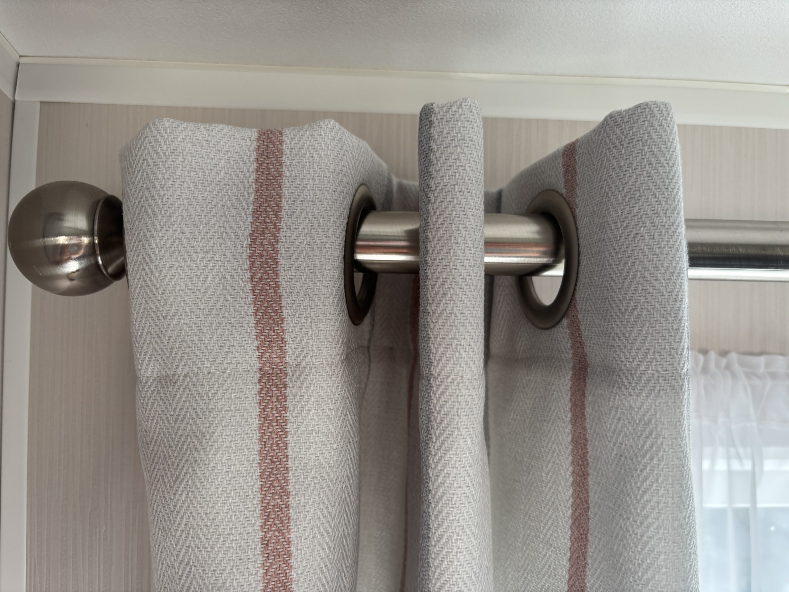 Twin bedroom curtains in the Willerby Manor 2023 caravan on Riverside 3 at Windy Harbour Holiday Park