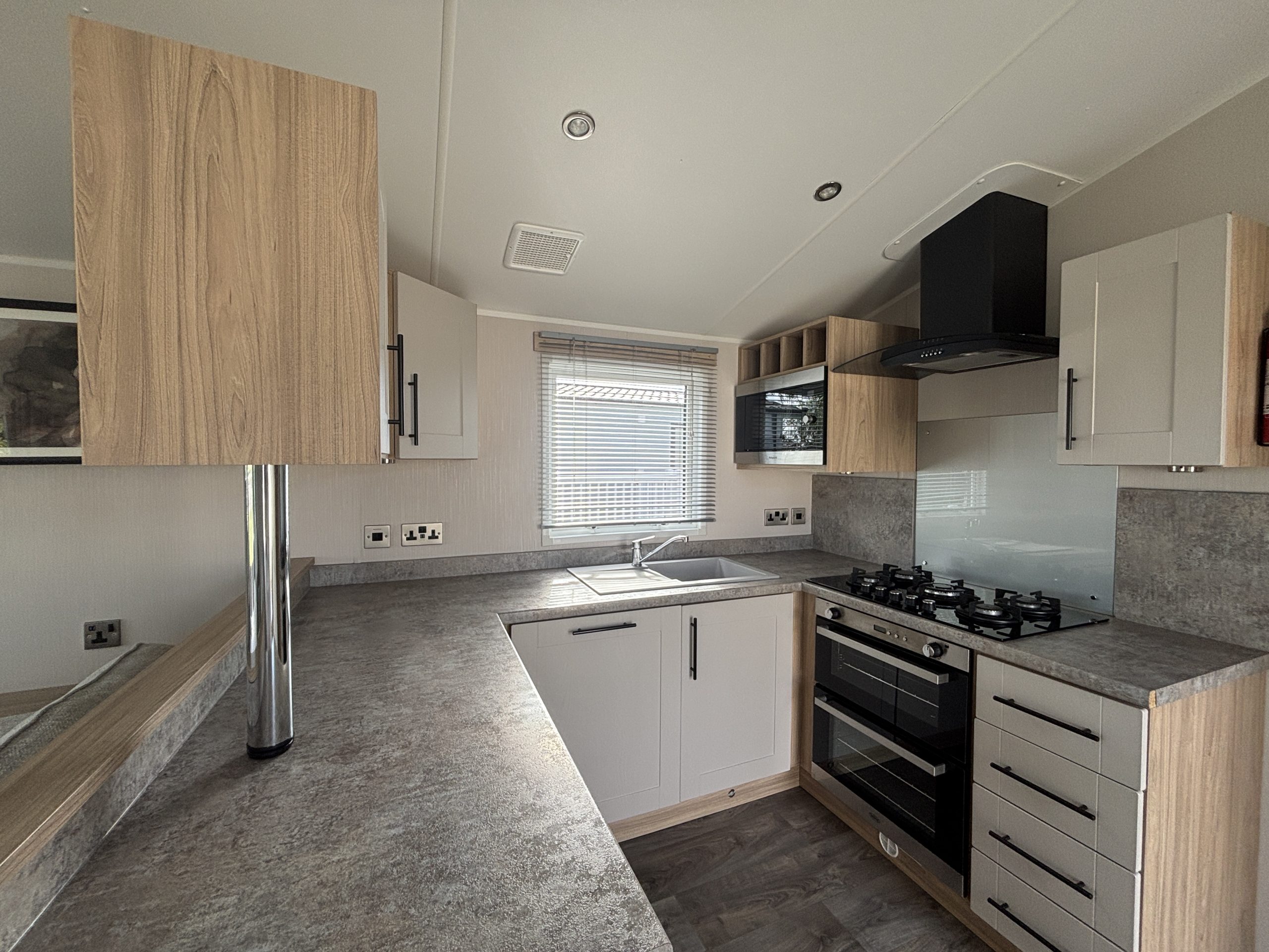 Kitchen area in the Willerby Manor 2023 caravan on Riverside 3 at Windy Harbour Holiday Park