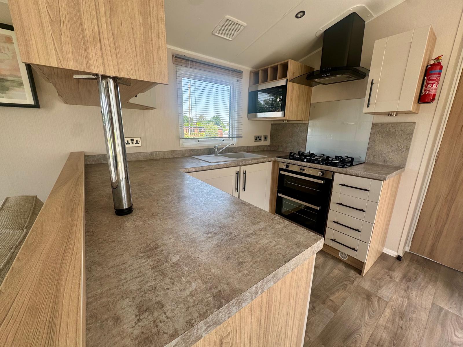 Kitchen area in the Willerby Manor 2023 at Windy Harbour Holiday Park