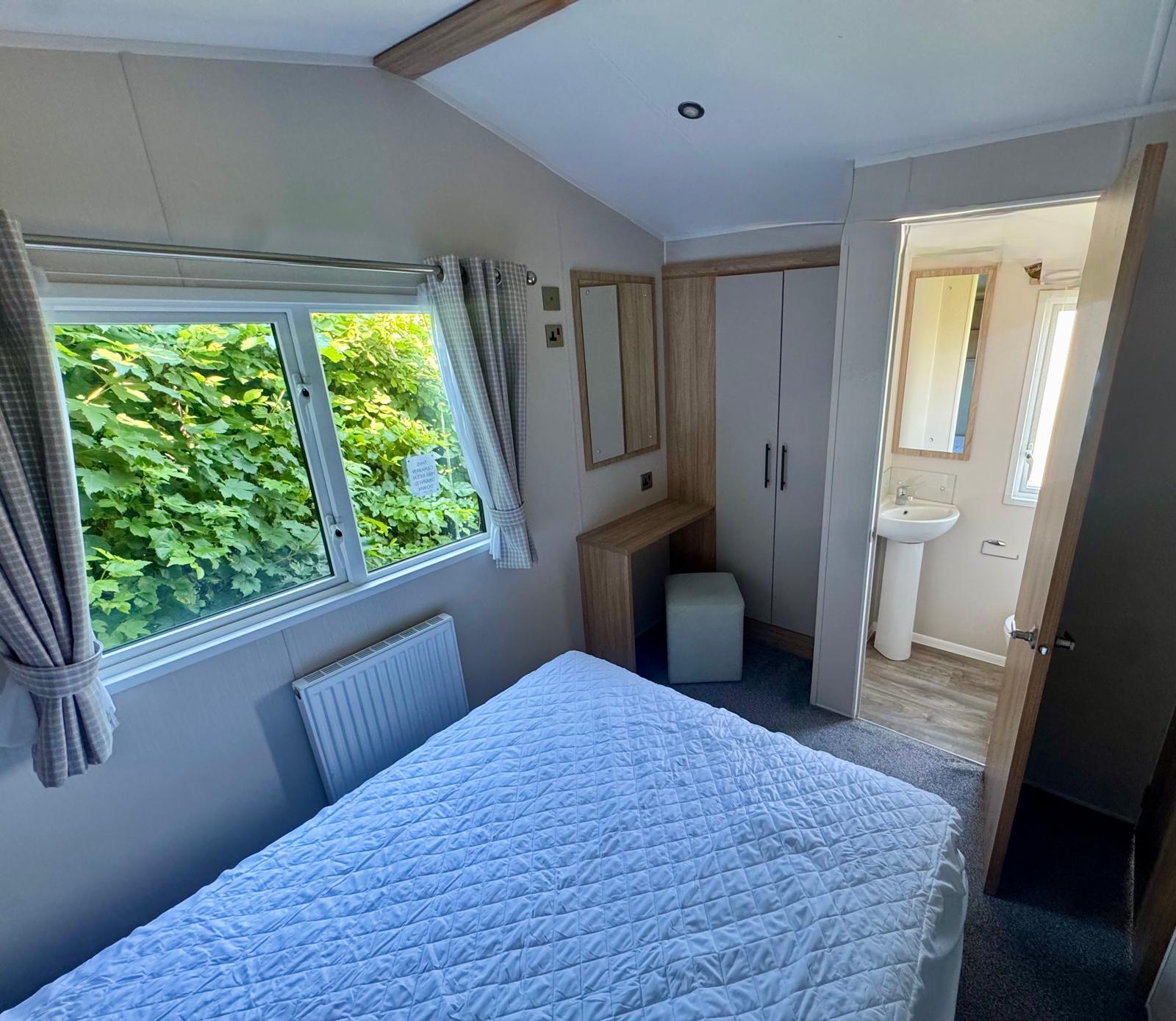 Master bedroom in the Willerby Manor 2023 caravan at Windy Harbour Holiday Park