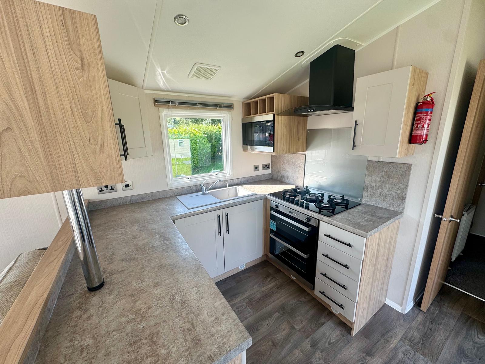 Open plan kitchen in the Willerby Manor 2023 caravan at Windy Harbour Holiday Park