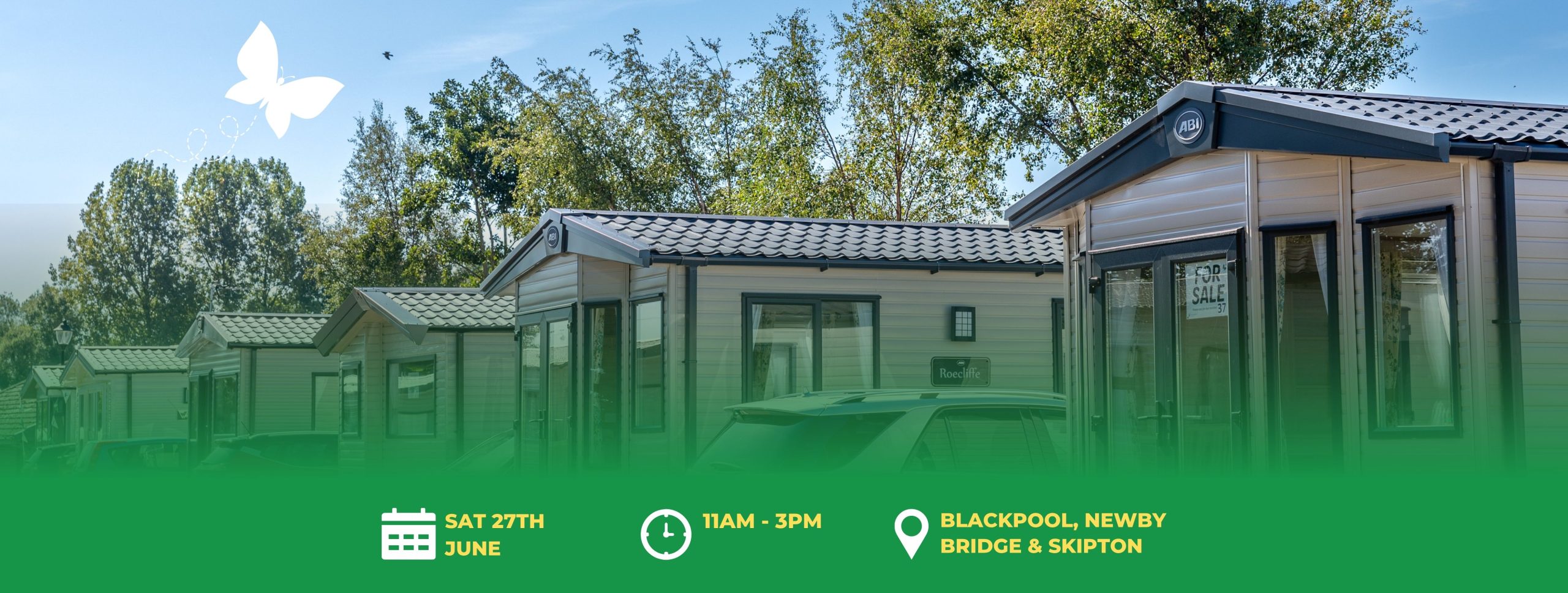 A row of static caravans at a holiday park with information about the upcoming open day happening on Saturday 27th June, 11am - 3pm across all Partington's Holiday Parks