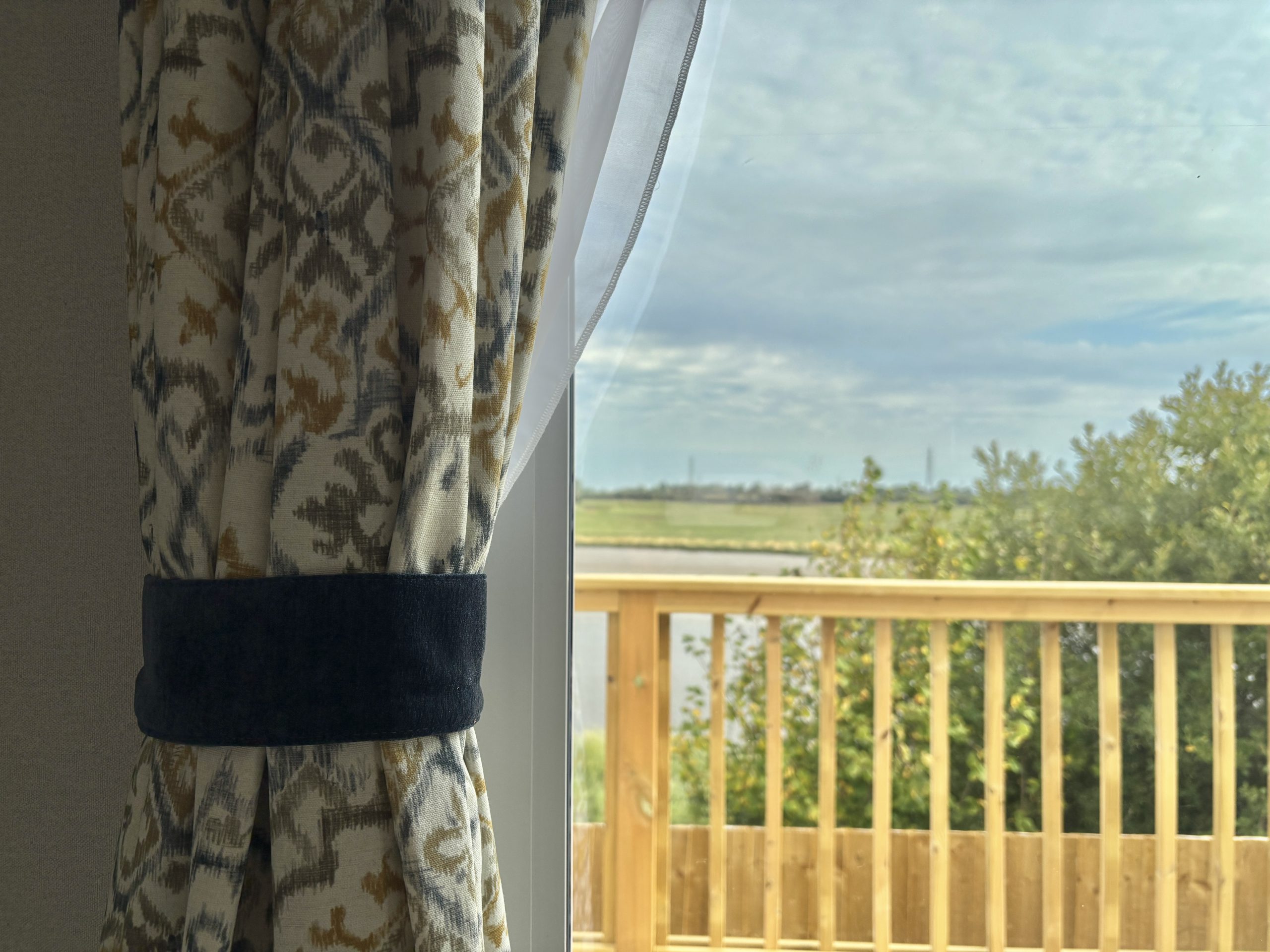 Detail shot of the living room curtains in the Willerby Ashcroft 2026 at Windy Harbour Holiday Park, Partington's