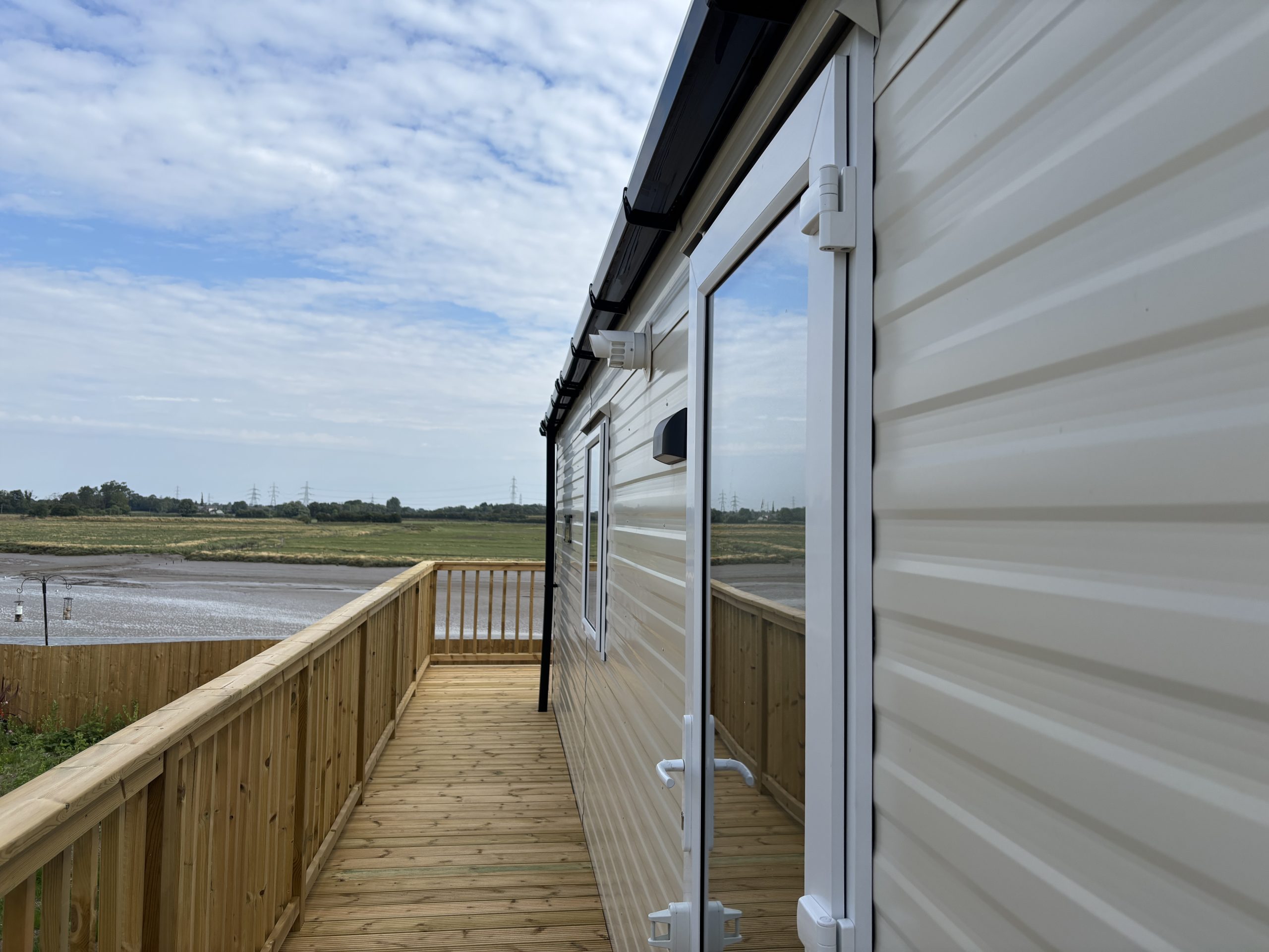 External shot of the Willerby Ashcroft 2026 overlooking the river at Windy Harbour Holiday Park
