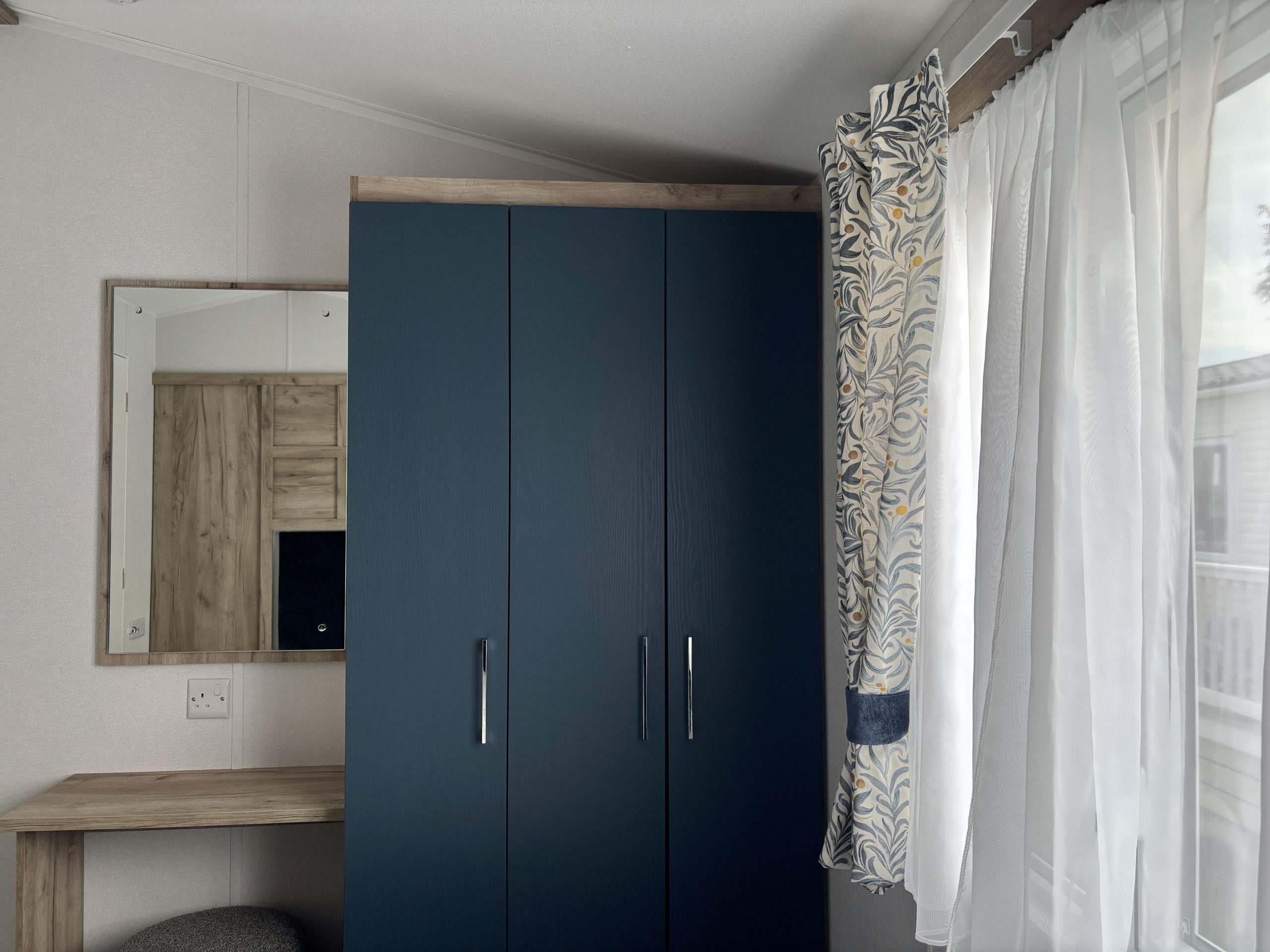 Image of the wardrobes and vanity area in the Master bedroom of the Willerby Ashcroft 2026 at Windy Harbour Holiday Park, Partington's