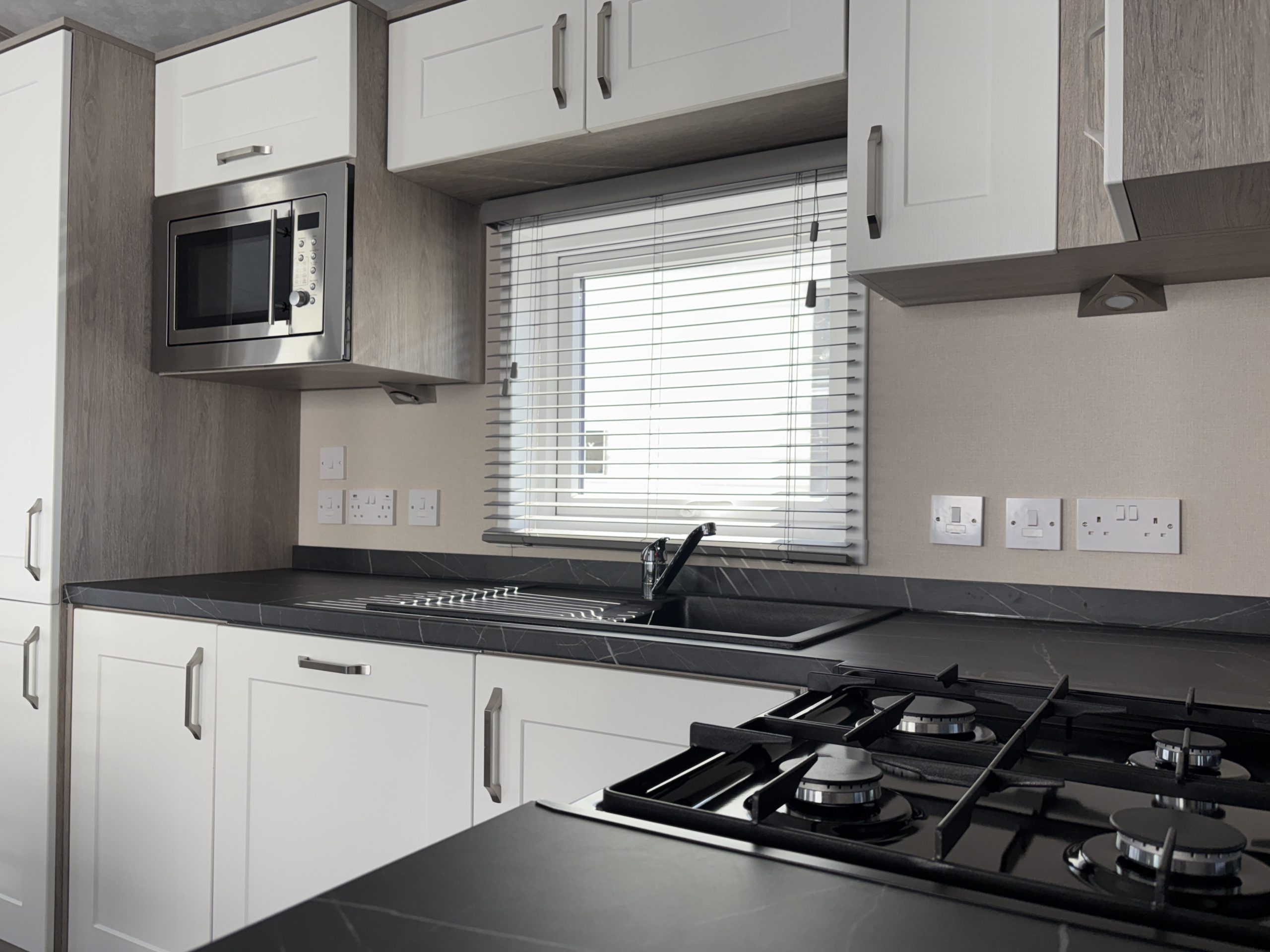 A side view of the kitchen and cooking area within the Pemberton Marlow 2026