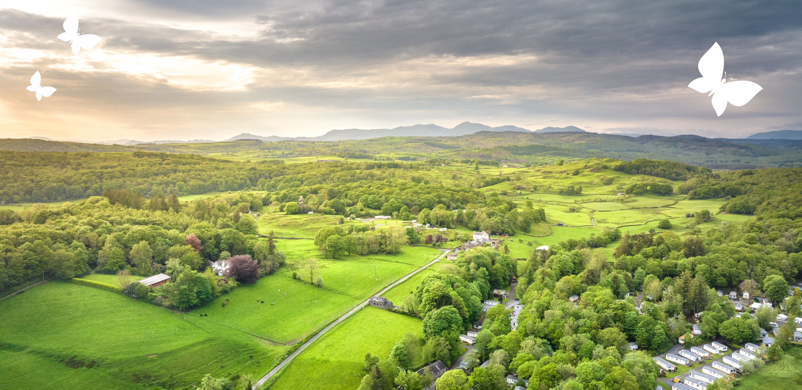 Aerial view of Black Beck Holiday Park in the Lake District with a moody sky