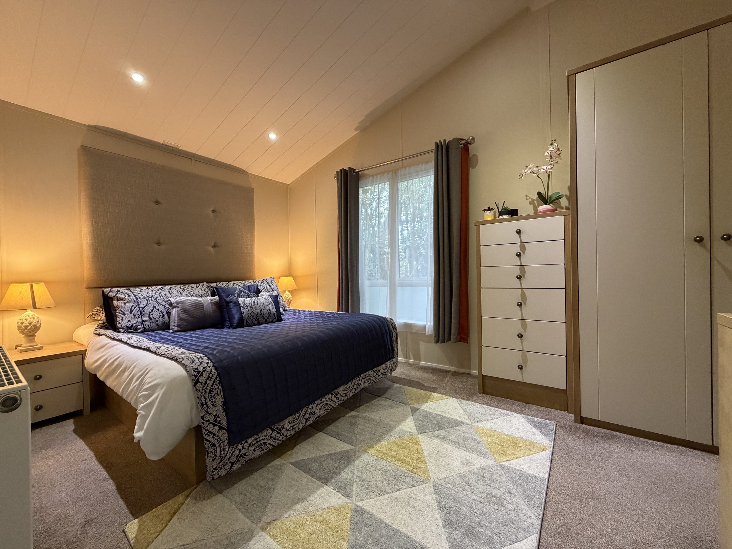 Photo of the Master Bedroom with floor to ceiling window in the Willerby Portland 2017 at Windy Harbour, a Partington's Holiday Park