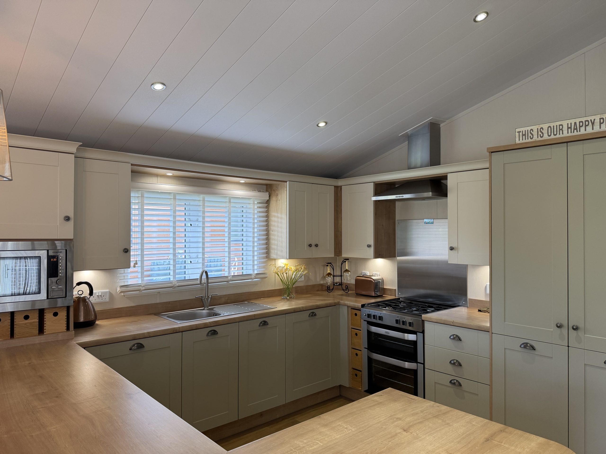 Image of the kitchen with integrated appliances in the Willerby Portland 2017 at Windy Harbour Holiday Park, Partington's