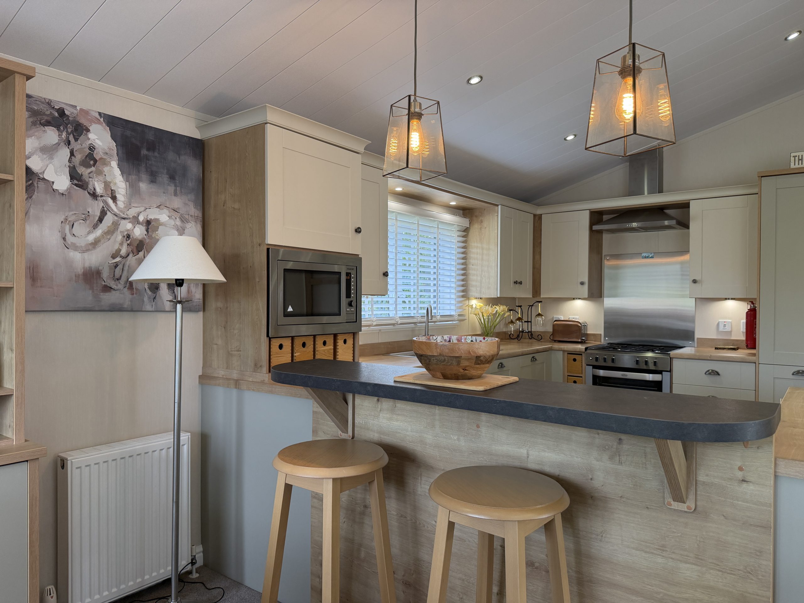 Image of the kitchen and breakfast bar in the Willerby Portland 2017 at Windy Harbour, a Partington's Holiday Park