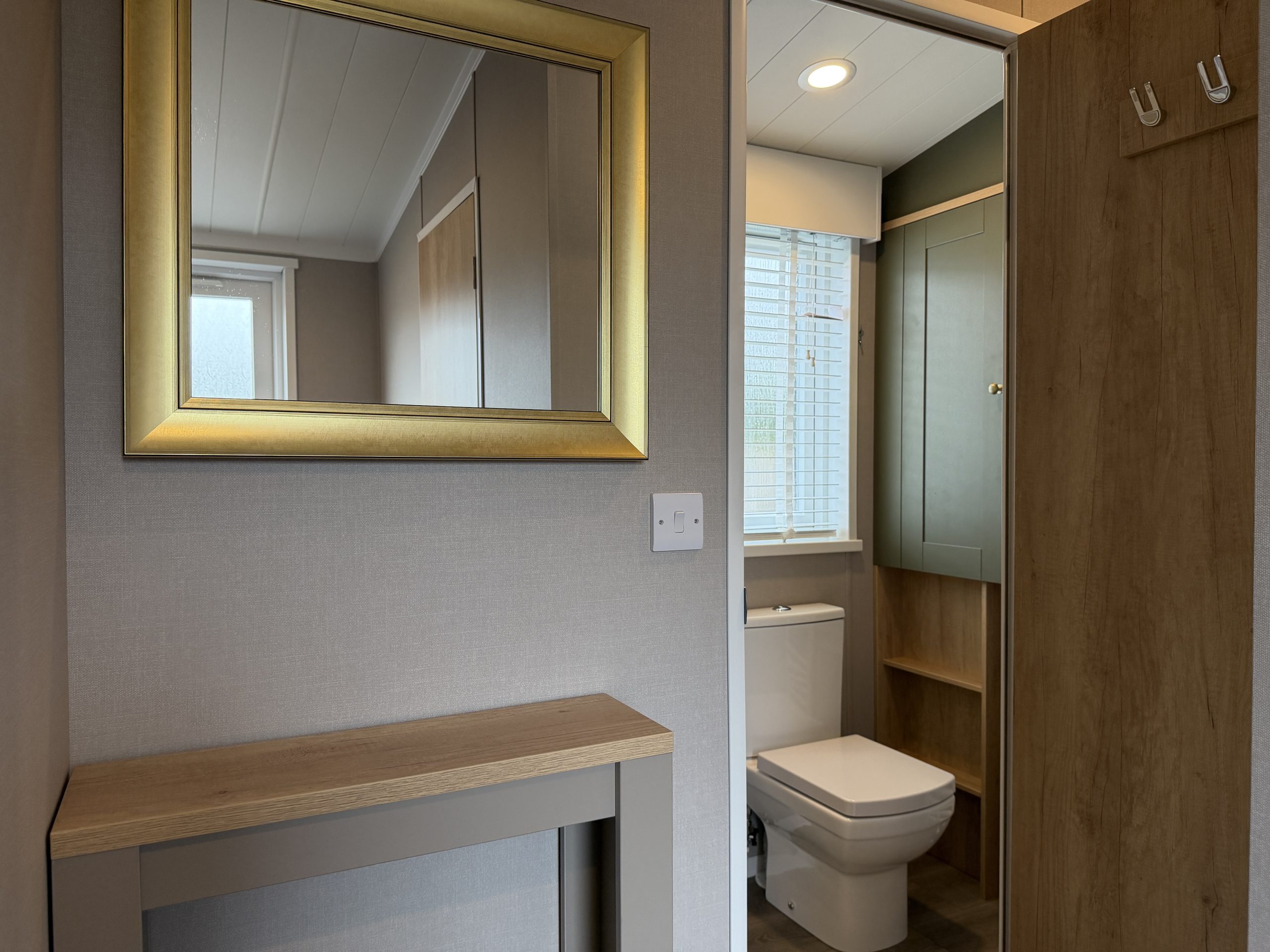 Image of the Swift Vendee Lodge 2026 entryway and main bathroom at Broadwater Holiday Park, Partington's