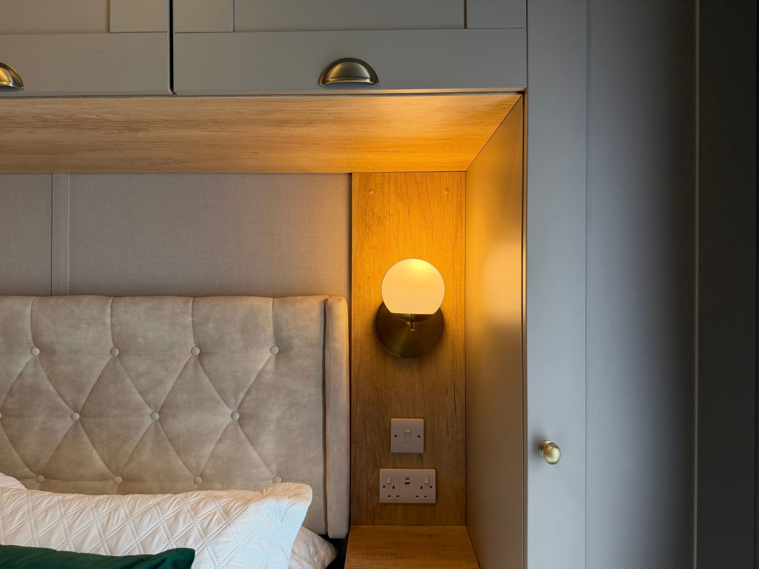 Detail shot of the lighting and bedside in the Master bedroom in the Swift Vendee Lodge 2026 at Broadwater Holiday Park, Partington's