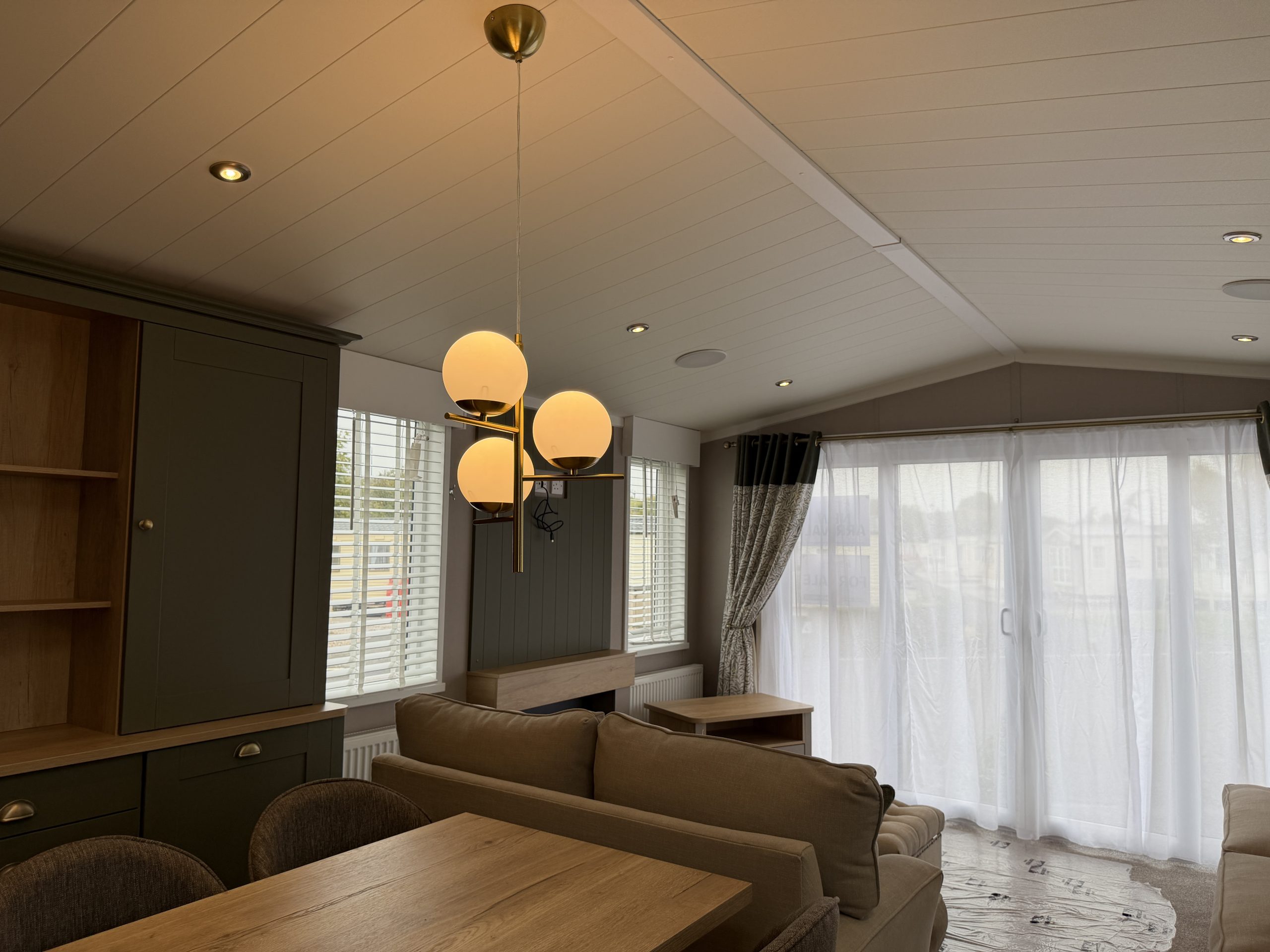 Image of the dining and living area in the Swift Vendee Lodge 2026 at Broadwater Holiday Park, Partington's