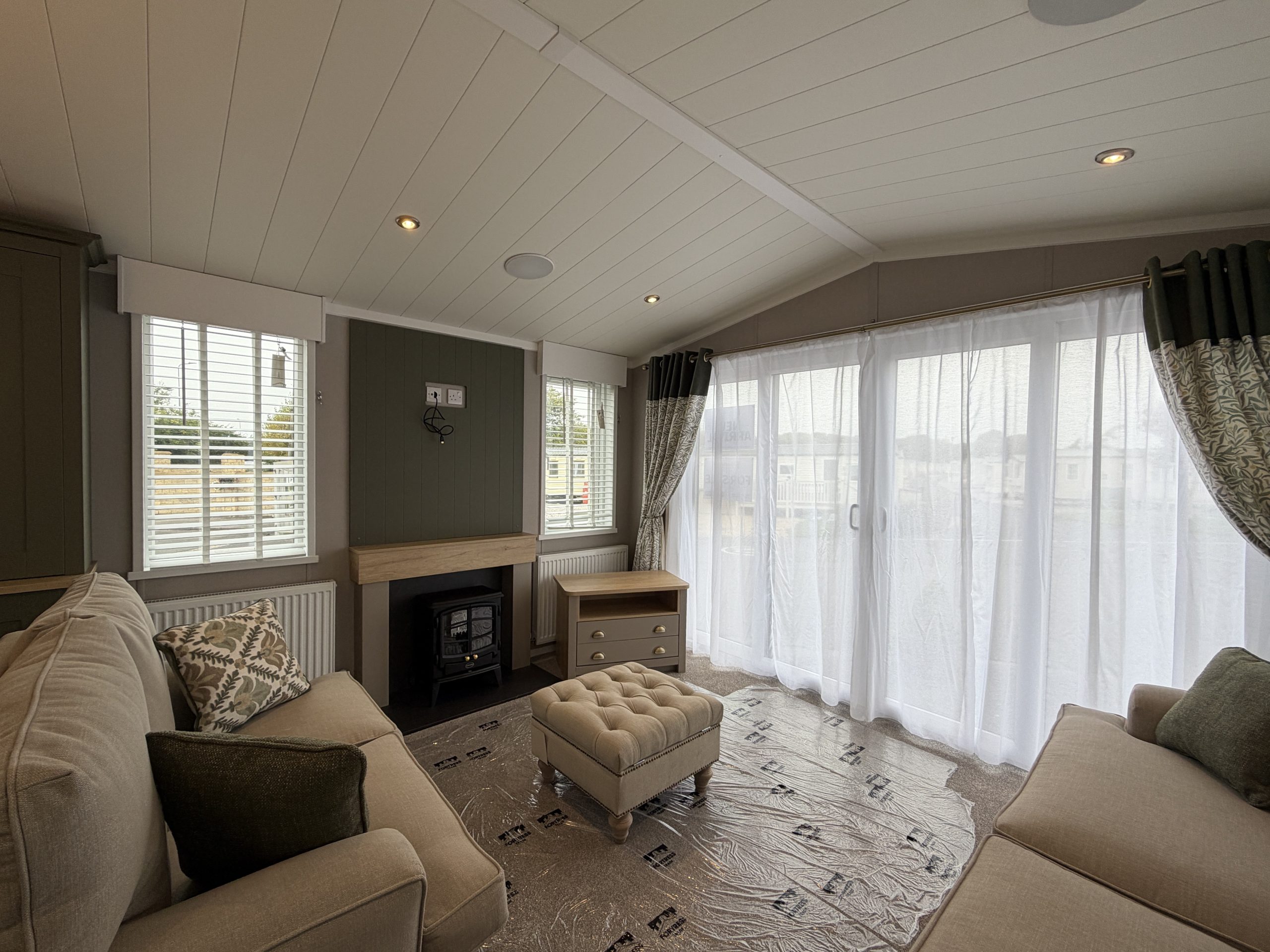 Image of the living area in the Swift Vendee Lodge 2026 at Broadwater Holiday Park, Partington's