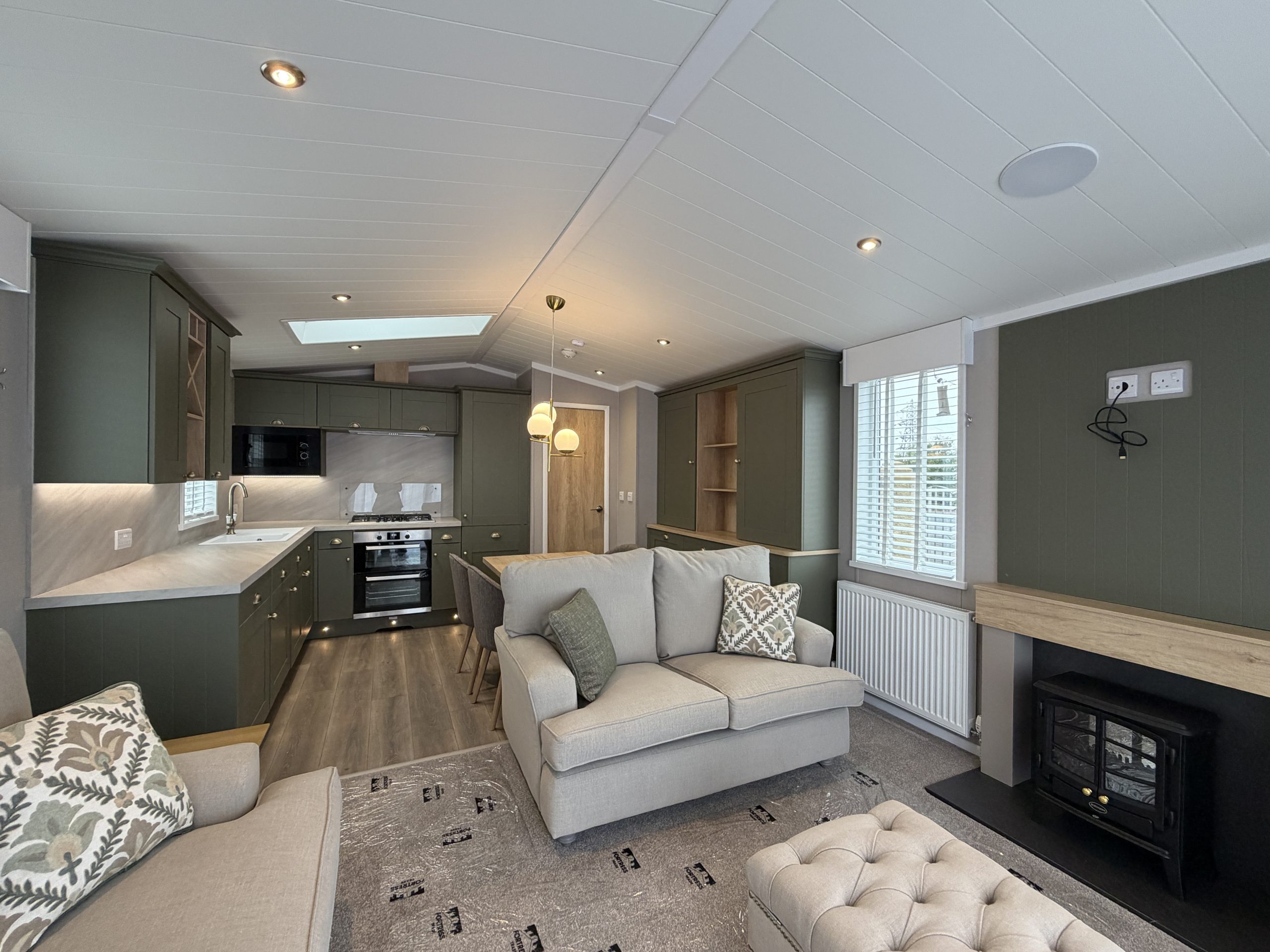 Image of the living area in the Swift Vendee Lodge 2026 at Broadwater Holiday Park, Partington's