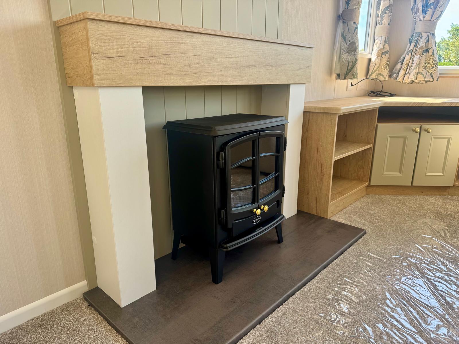 Fireplace in the Swift Provence 2025 caravan at Windy Harbour Holiday Park